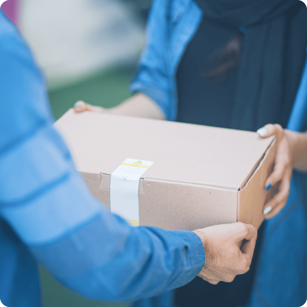 Image of person handing another person a box